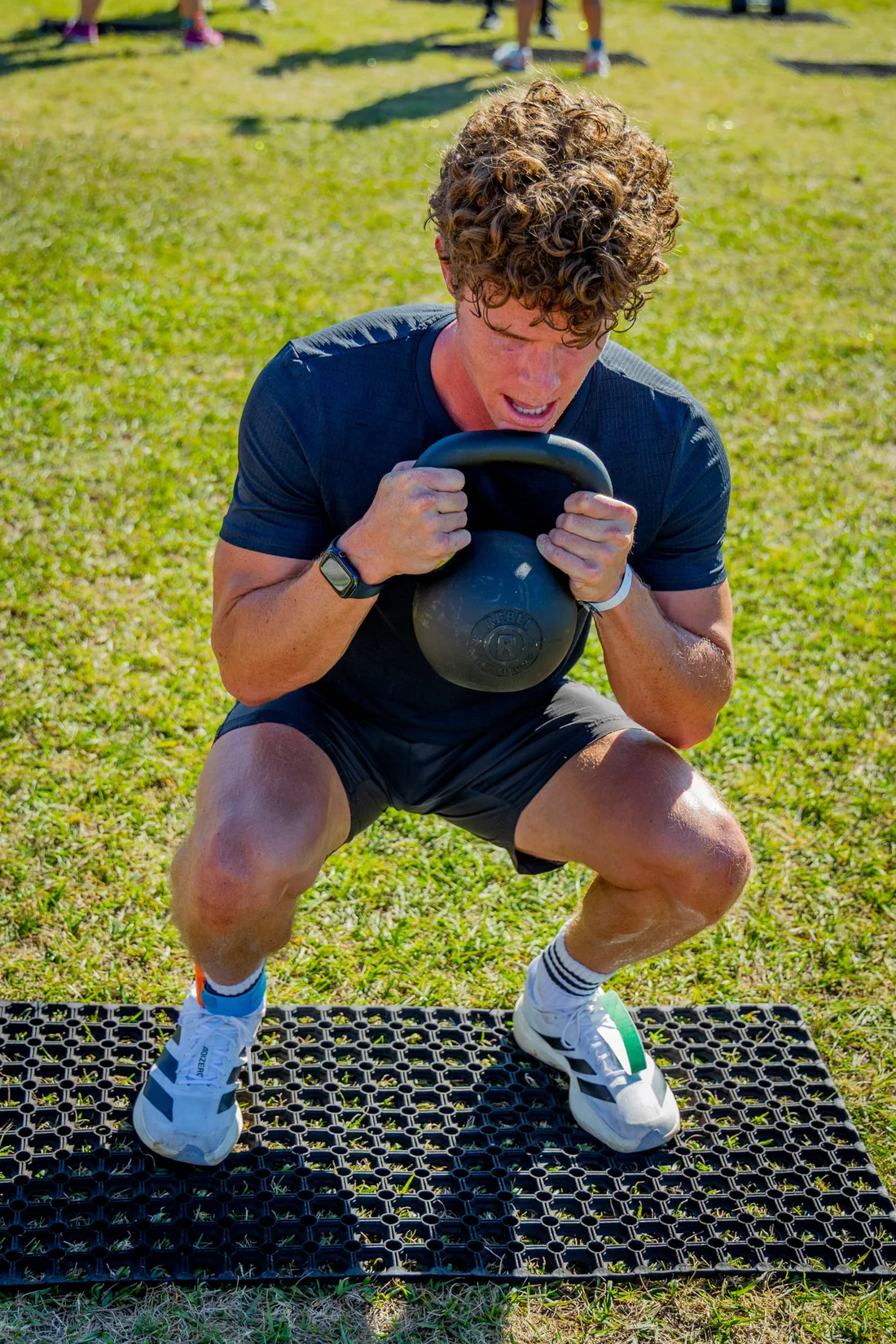 A kettlebell squat at Deadly Dozen
